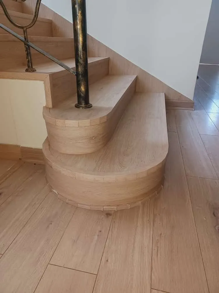 Curved staircase installation, Dubai villa interior fit-out — photo 1
