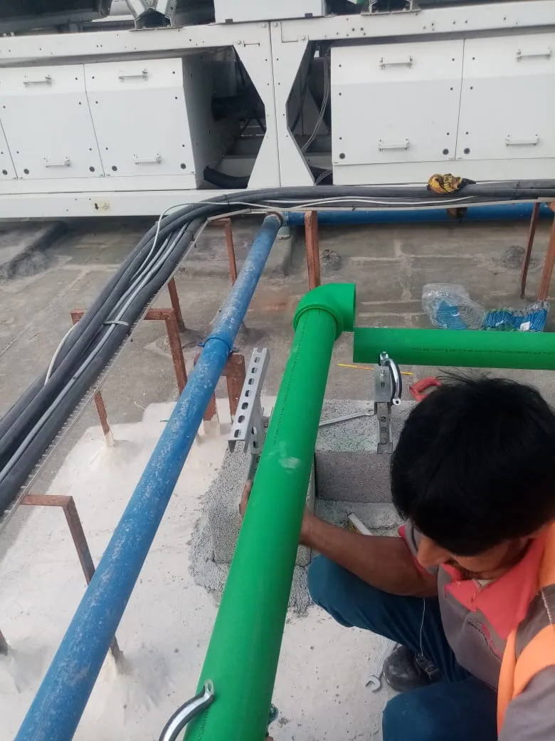 Rooftop piping installation, UAE building — photo 1