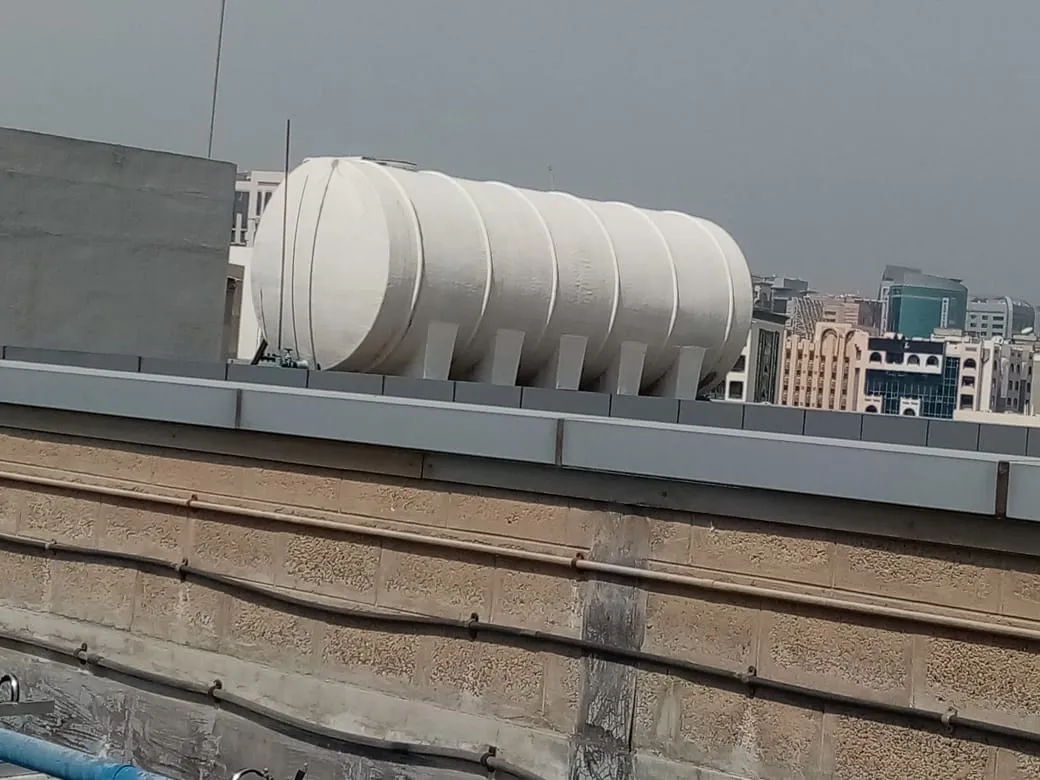 Rooftop water tank installation, UAE building — photo 3