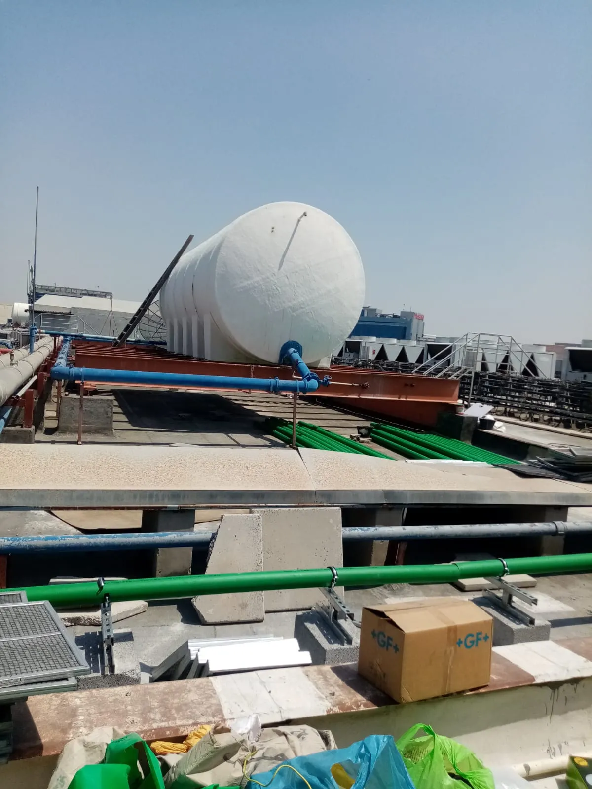 Rooftop water tank installation, UAE building — photo 8